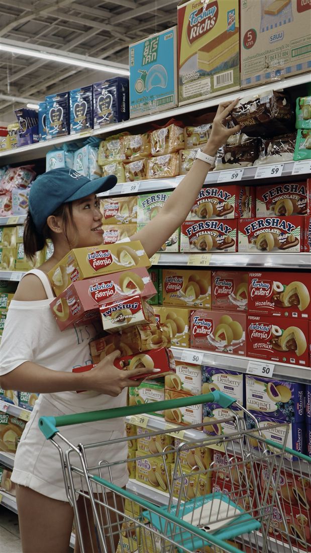 Steph filming a daily vlog in a grocery store